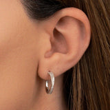 Aniq Pavé Crossover Huggie Earrings | Sterling Silver | 15mm | Hypoallergenic